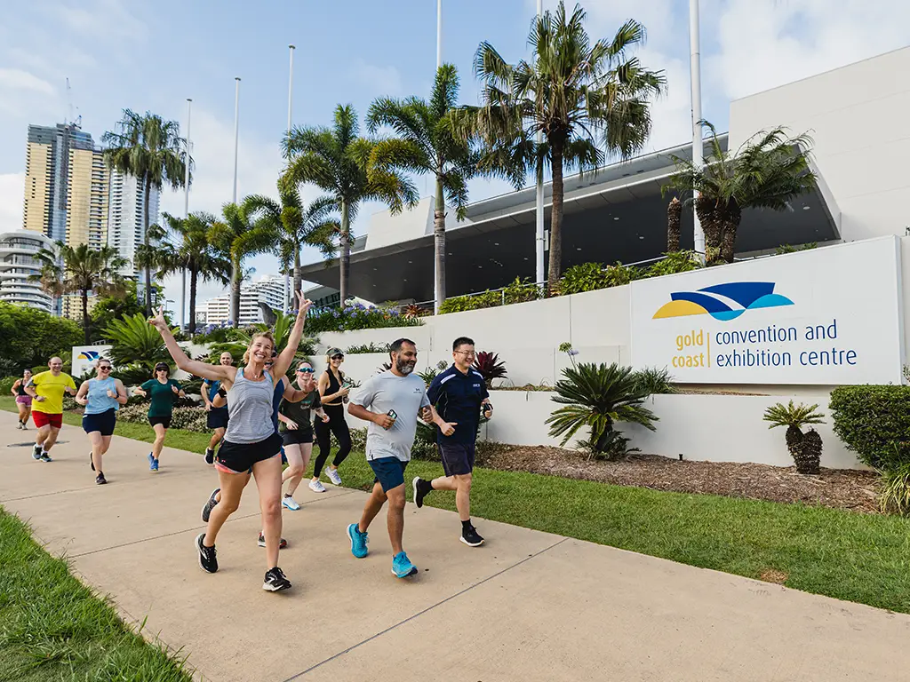 Fun runners passing by Gold Coast Convention & Exhibition building during AusRAIL 2024
